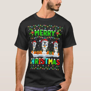 Camiseta Xmas Pingüino Ave iluminando Santa Hat Feliz Navid