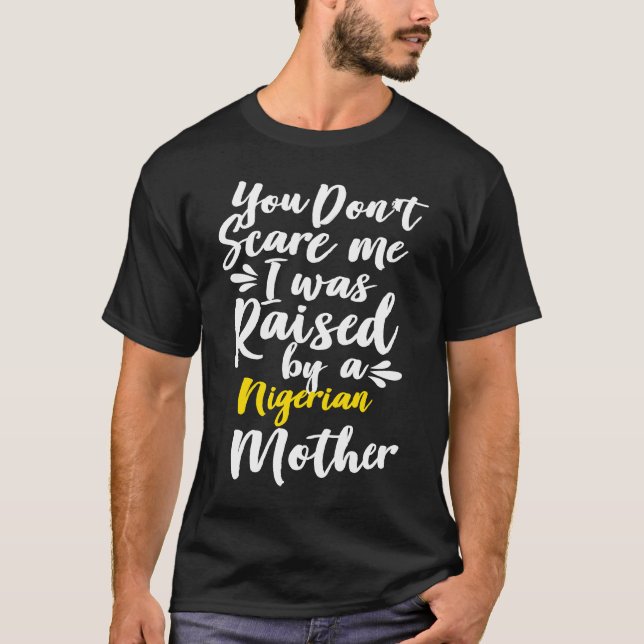 Camiseta You Don't Scare Me I Was Raised By A Nigerian (Anverso)