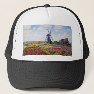 Campo de Monet de tulipanes con el gorra del