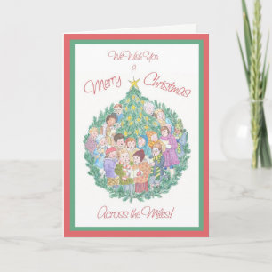 Cantantes de Carol y árboles de Navidad a lo largo