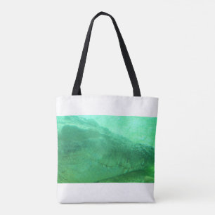 Cara de ligador verde sobre una bolsa de tela