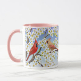 Cardenales en el florecimiento de la taza del