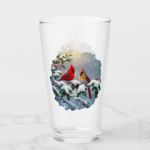 Cardenales rojos y acebo en la nieve