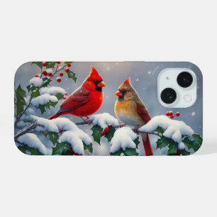 Cardenales rojos y Holly en la nieve