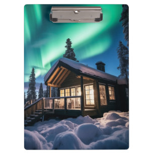 Carpeta De Pinza Aurora borealis sobre la cabaña de invierno