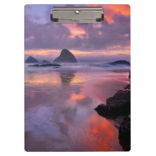 Carpeta De Pinza Playa y montones de mar de Oregón, puesta de sol