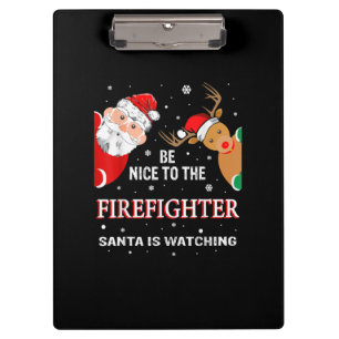 Carpeta De Pinza Sé Agradable Con El Bombero Que Santa Está Viendo