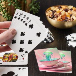 Cartas de juego de medusas en taza de té