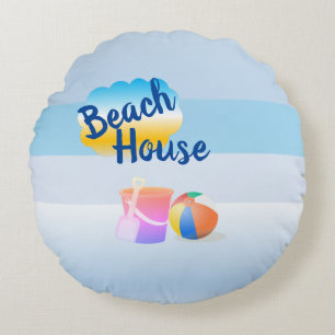 Casa de playa azul y rosa con cojines redondos