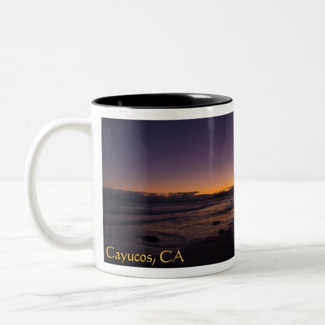 Cayucos, taza de la puesta del sol de la playa de (Izquierda)