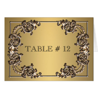 Cena boda con números de mesa ornamentados con oro