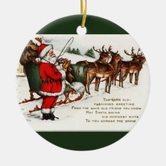 Cerámica Santa y Sleigh con un adorno de círculo de renos