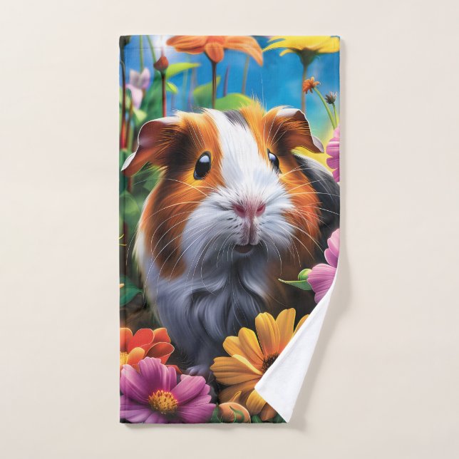 Cerdo guineano entre flores vibrantes (Toalla de mano)