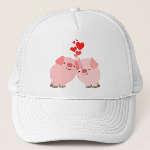 Cerdos lindos del dibujo animado en gorra del amor