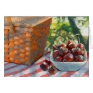 Cerezas y cesta de picnic