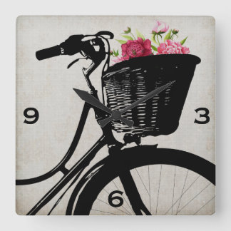 Cesta de la bicicleta con el reloj de pared de los