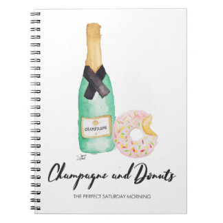 Champán y cuaderno de la acuarela de los anillos