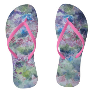 Chanclas Danza entre los flips-flopes de las flores