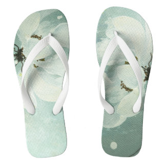 Chanclas flips-flopes de la flor blanca