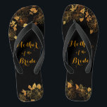 Chanclas Madre de la novia de lujo negro y oro follaje<br><div class="desc">Estas magníficas sandalias "Madre de la Novia" de lujo negro y dorado ostentan una lujosa paleta dorada y negra, con un impresionante patrón dorado floral y una tipografía moderna sobre un fondo negro, con una elegancia y una sofisticación exuberantes. Es un hermoso regalo para tu fiesta de novias. Vea la...</div>