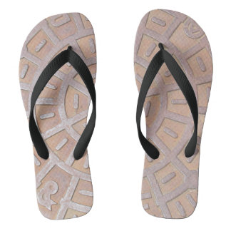 Chanclas - tapa de alcantarilla.