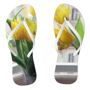 Chanclas Vista a través de tulipanes amarillos