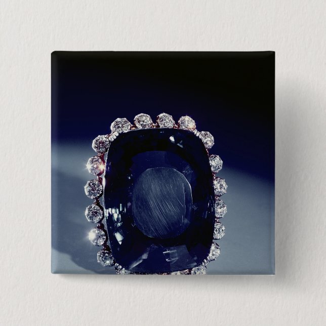 Chapa Cuadrada La broche de Logan (Anverso)