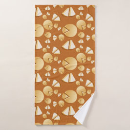 Cheese wheels and slices on a burnt orange