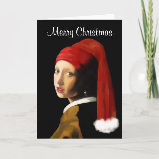 Chica con la tarjeta de Navidad del pendiente de