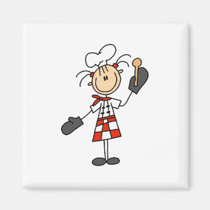 Chica del cocinero con los imanes de madera de la