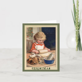 Chica horneando cookies con la tarjeta de Navidade