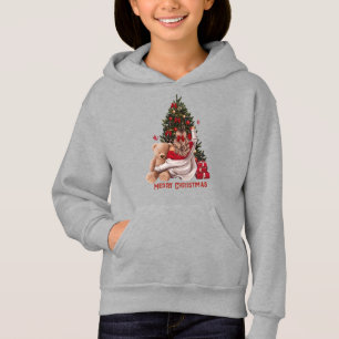 Chica linda y árbol de Navidad con oso de peluche