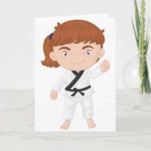 Chica que hace tarjetas de felicitación del karate