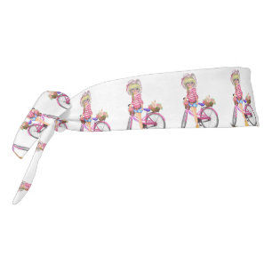 Chica rubio con cinta para bicicleta rosa