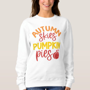 Cielos otoñales y polos de calabaza acogedores oto