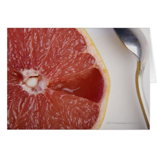 Cierre de un trozo de naranja y una cuchara (Anverso (Horizontal))