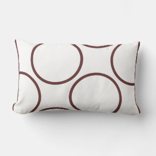 círculos marrones sobre almohada blanca moderna