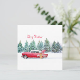 Coche rojo vintage de Navidad con paisaje nevado