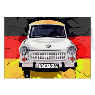 Coche trabante y bandera alemana, muro de Berlín