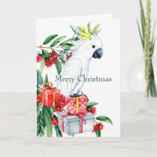 Cockatoo blanco presenta Feliz Navidad