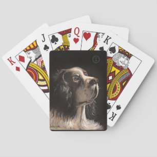 cocker spaniel jugando cartas de póquer