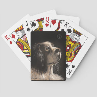 cocker spaniel jugando cartas de póquer