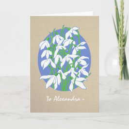 Cojetas de nieve blancas en la tarjeta de cumpleañ