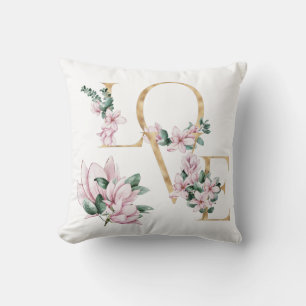 Cojín Decorativo Amor en letra dorada con flores de magnolia