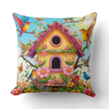 Aves colgando alrededor de una casa de pájaros