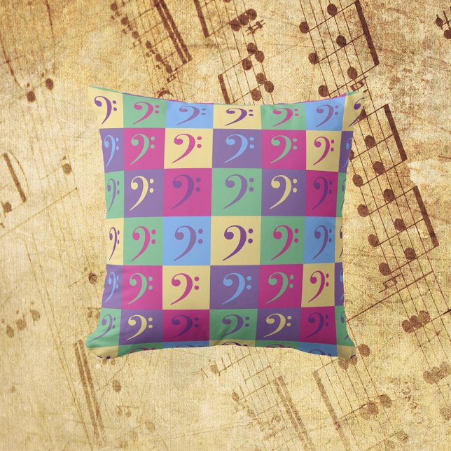 Cojín Decorativo Bass Clef Music Pattern Bright (A throw pillow with a colorful pattern of bass clef symbols.)