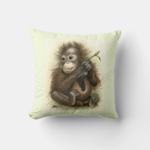 Cojín Decorativo Bebé orangután con hojas
