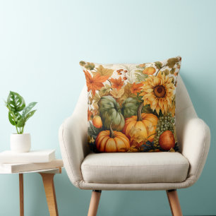 COJÍN DECORATIVO BOMBA NARANJA Y VERDE EN CAÍDA Y FLORES INFERIORES