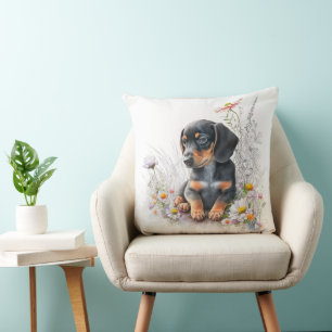 COJÍN DECORATIVO CACHORRO DE PERRO DACHSHUND NEGRO Y MARRÓN CON FLO