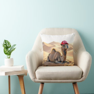 Cojín Decorativo Camello del desierto que lleva una gorra roja de j